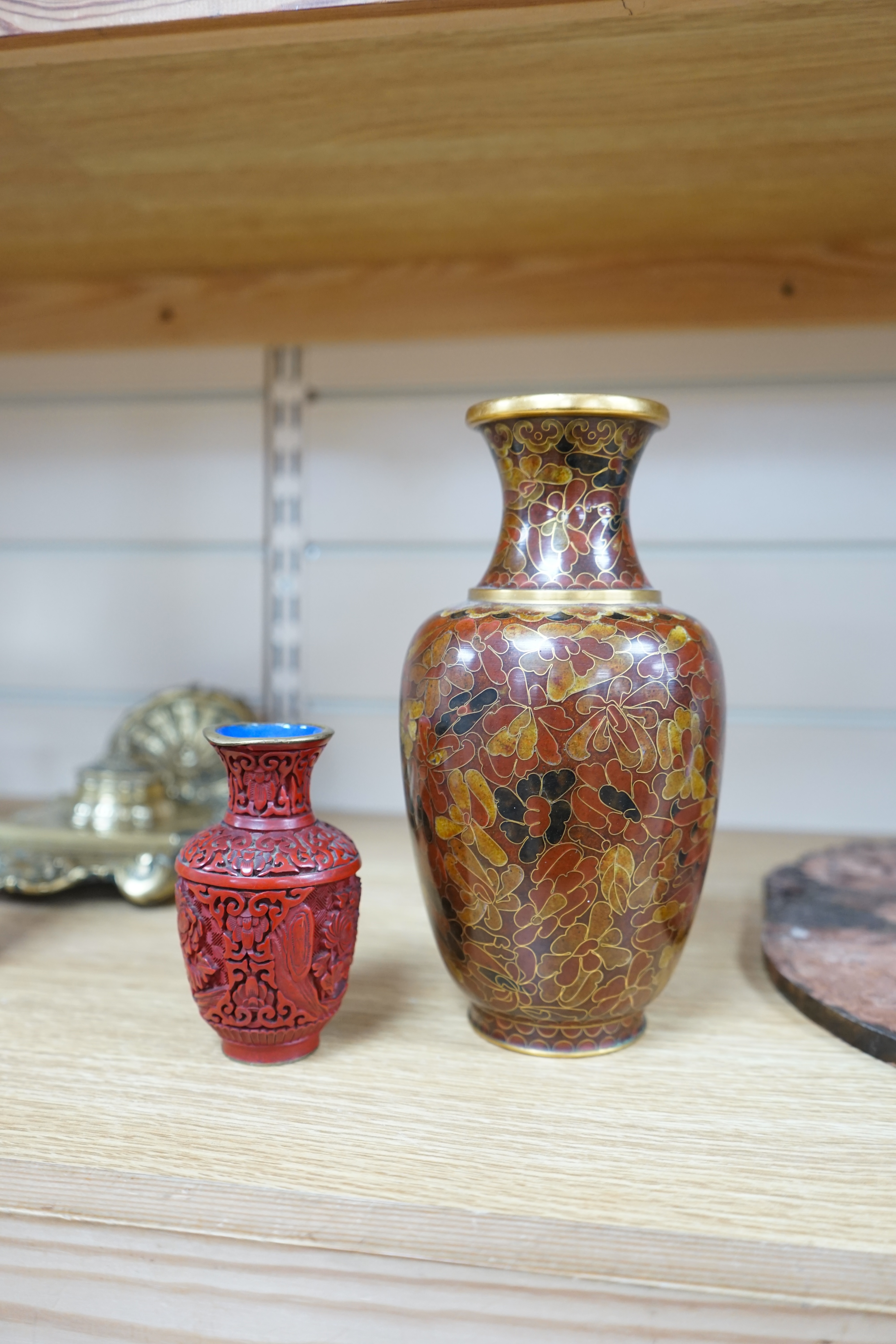 A Chinese archaistic hardstone large bi disc, a cinnabar lacquer vase and a cloisonné enamel vase, largest 32cm high (3). Condition - fair to good